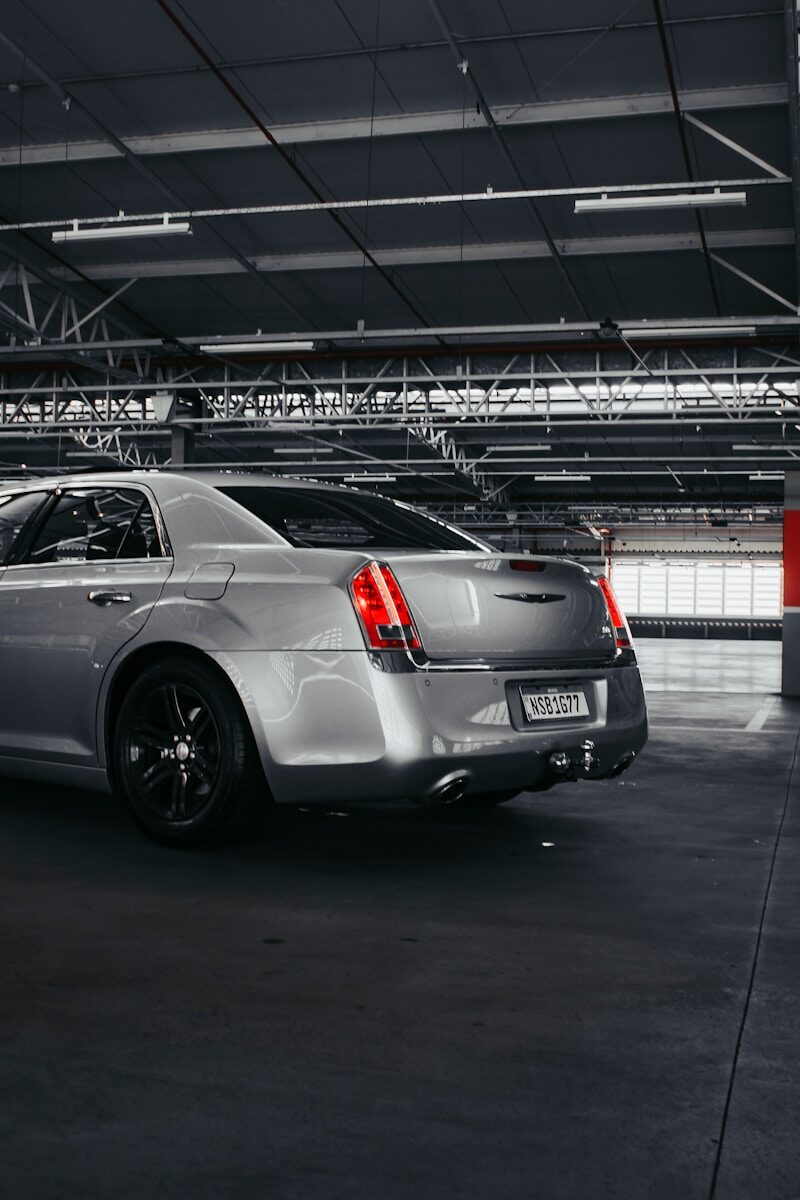 Chrysler 300C with wedding ribbons at Fawsley Hall, Northamptonshire, Silver Crown Weddings, www.silvercrownweddings.com, 07345686009, contact@silvercrownweddings.com